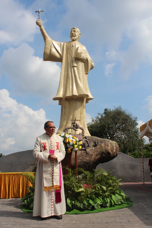Vatican nuncio in front of st francis xavier statue
